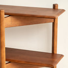 Wooden shelf with a plain background